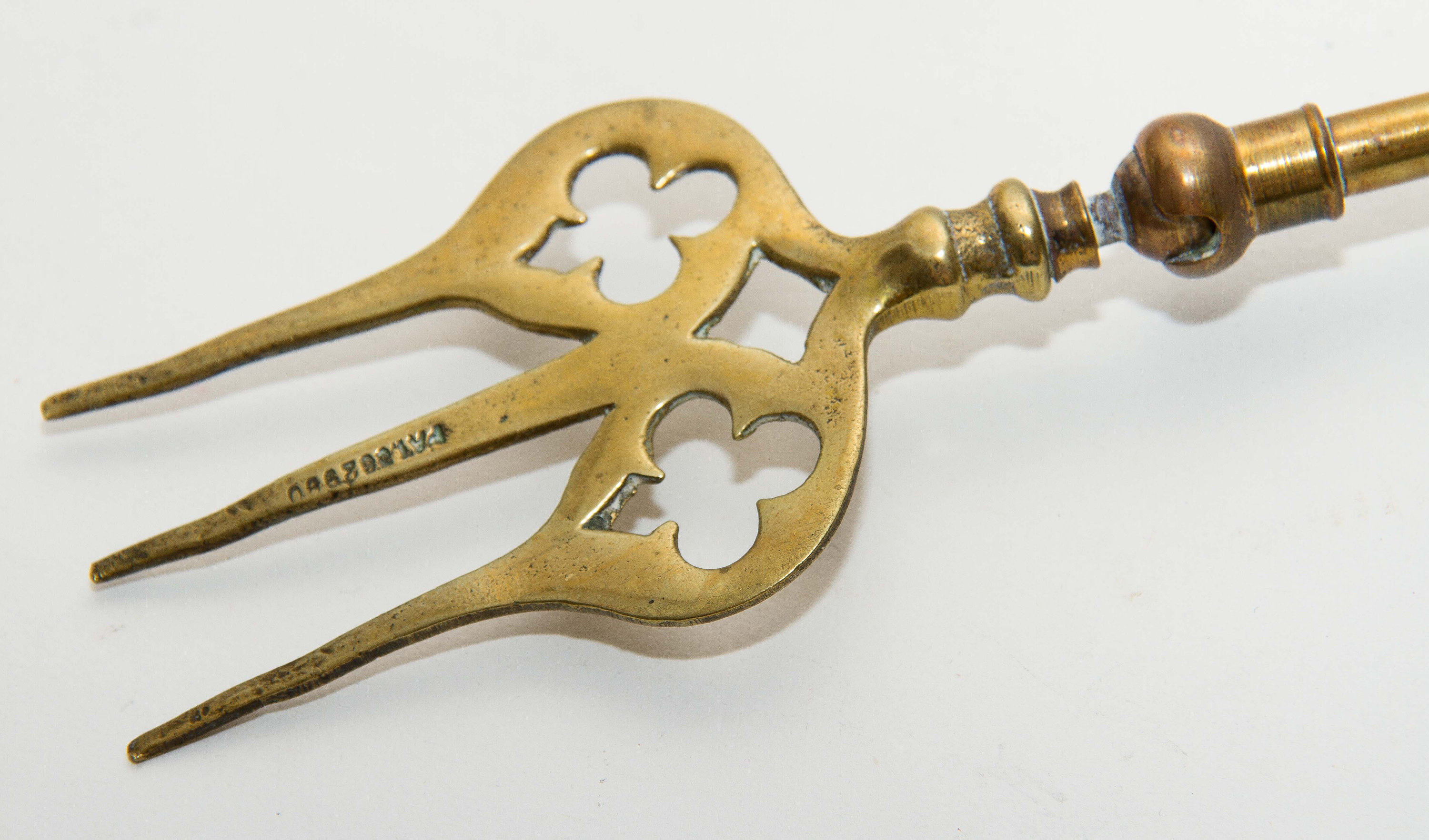 Shanklin, Isle of Wight, England brass toasting fire fork jointed ball moving end long fork Patented Registered design