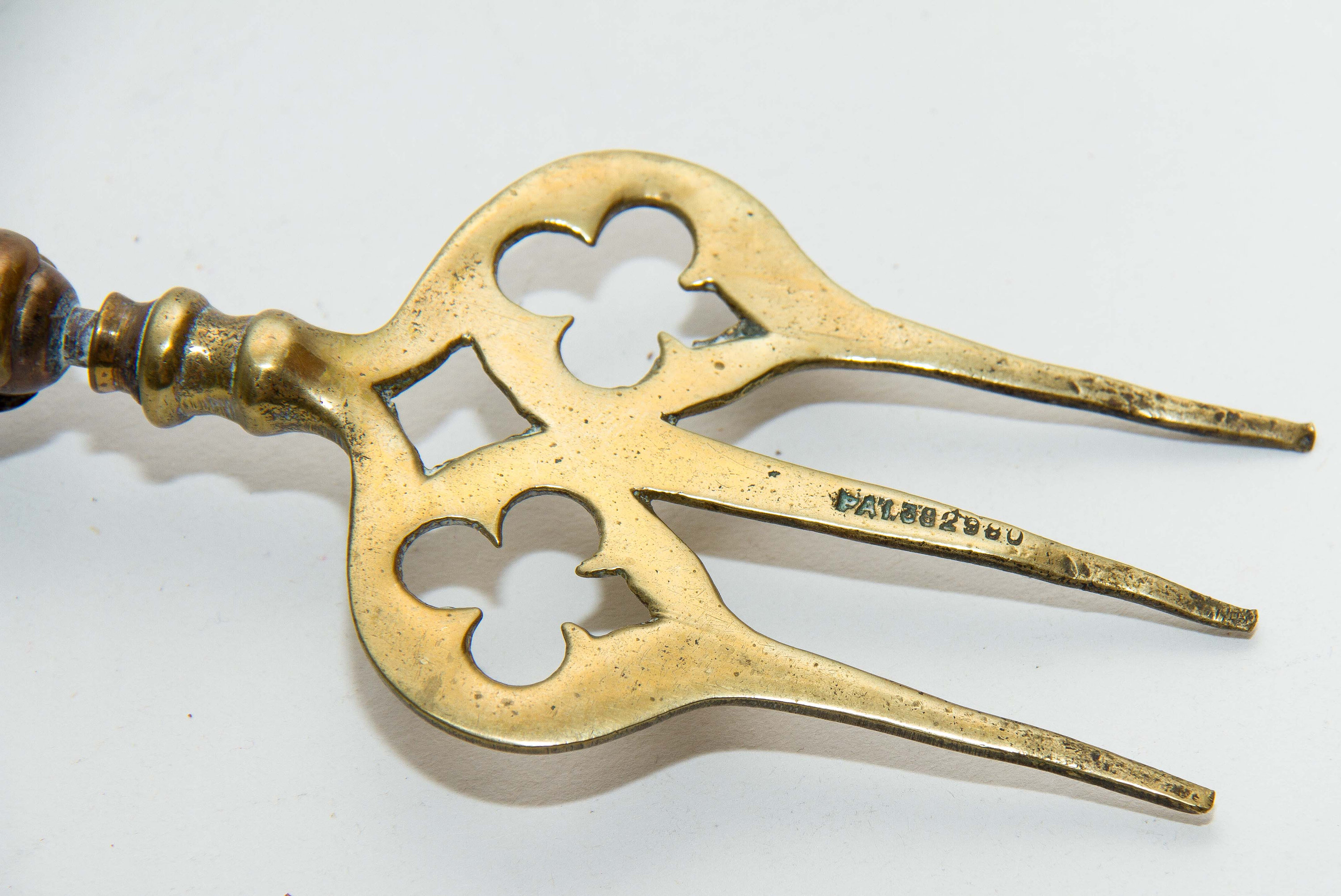 Shanklin, Isle of Wight, England brass toasting fire fork jointed ball moving end long fork Patented Registered design