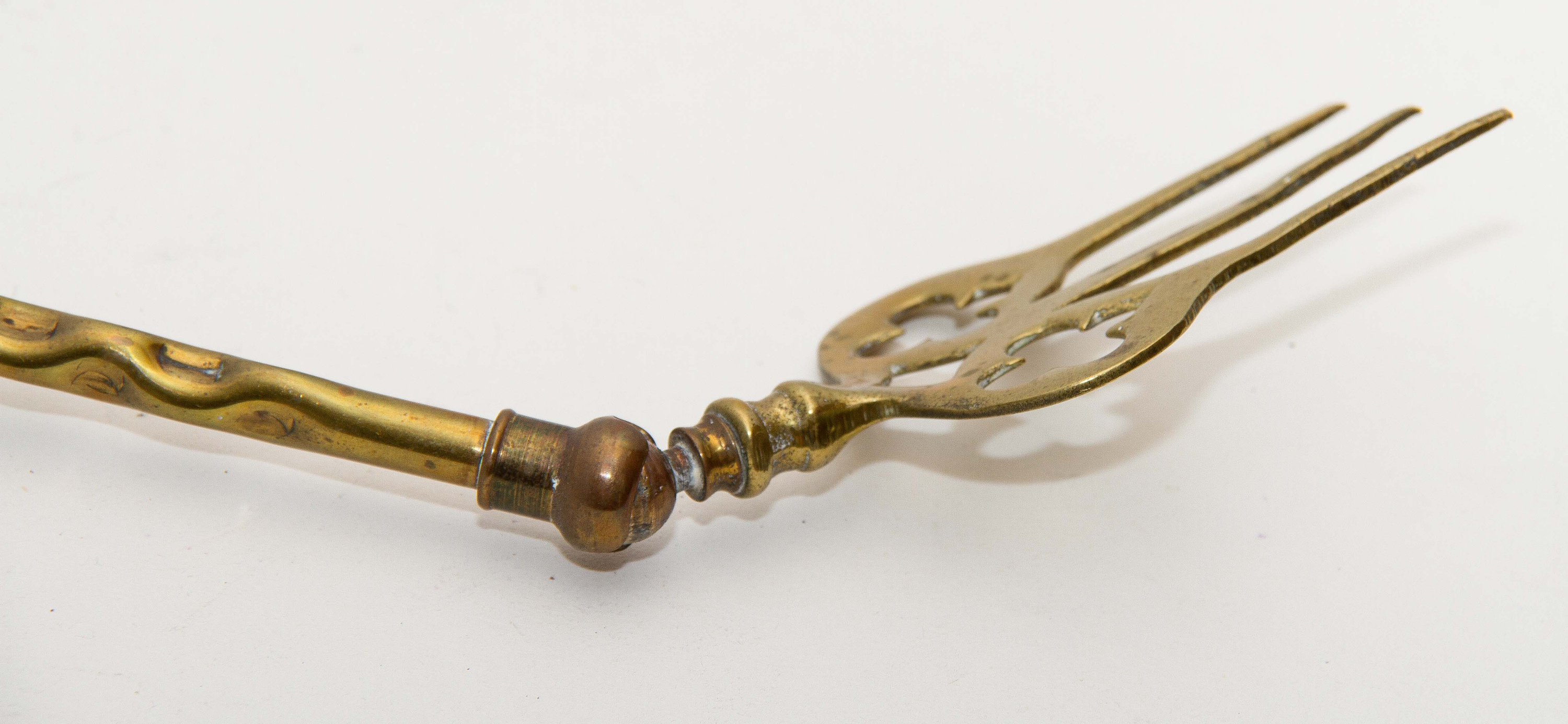 Shanklin, Isle of Wight, England brass toasting fire fork jointed ball moving end long fork Patented Registered design