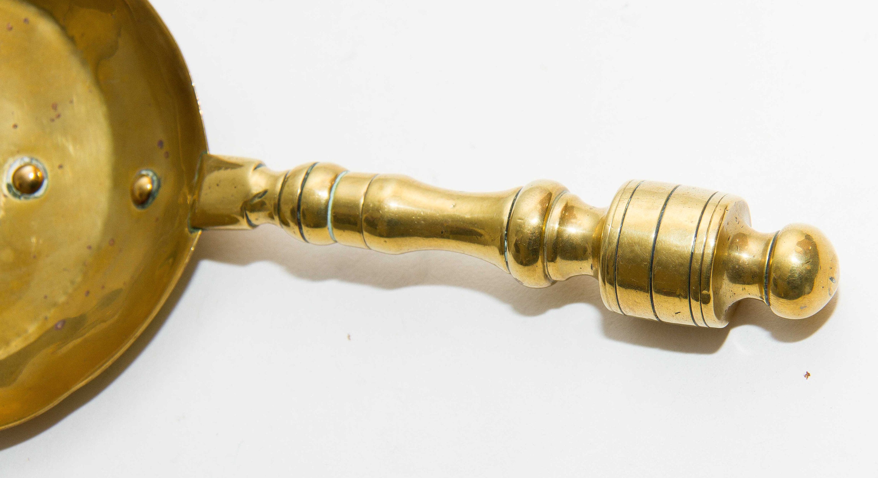 Brass decorative shovel cut out pattern fireside coal shovel fireplace accessory. Display prop bar cafe pub restaurant