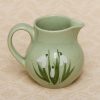Holkham Studio Pottery small green jug with a hand painted snowdrops