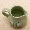Holkham Studio Pottery small green jug with a hand painted snowdrops