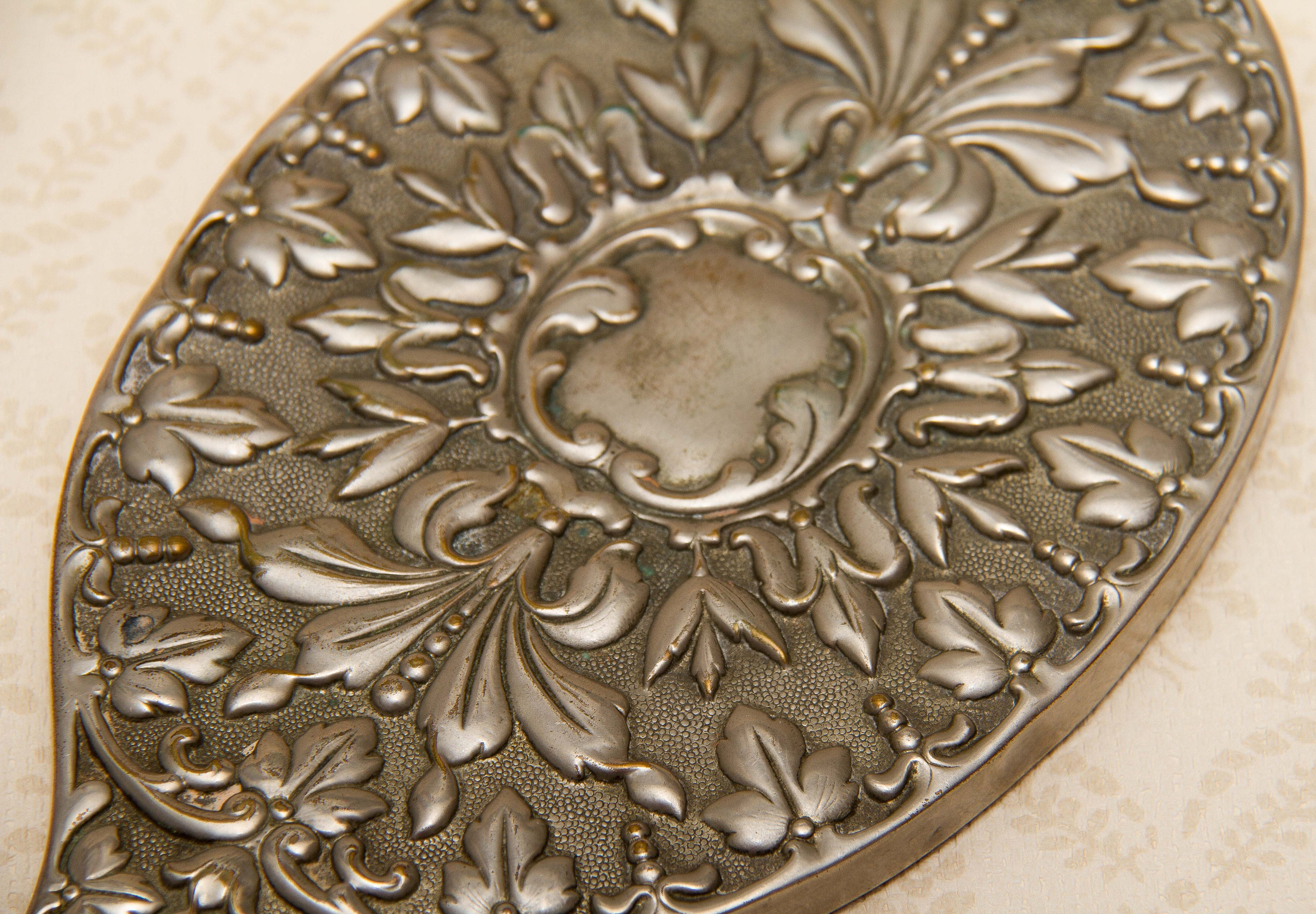A quality vintage silver plated ornate hand vanity mirror. The mirror is a good weight and has a bevel edge mirror., Vintage Ornate Silver Plated Hand Mirror Vanity beveled edge oval mirror with handle dressing table mirror